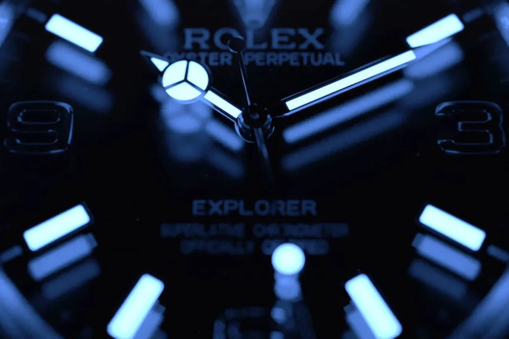Glowing Rolex Explorer replica dial in dark with blue Super-Luminova for enhanced low-light readability and visibility.
