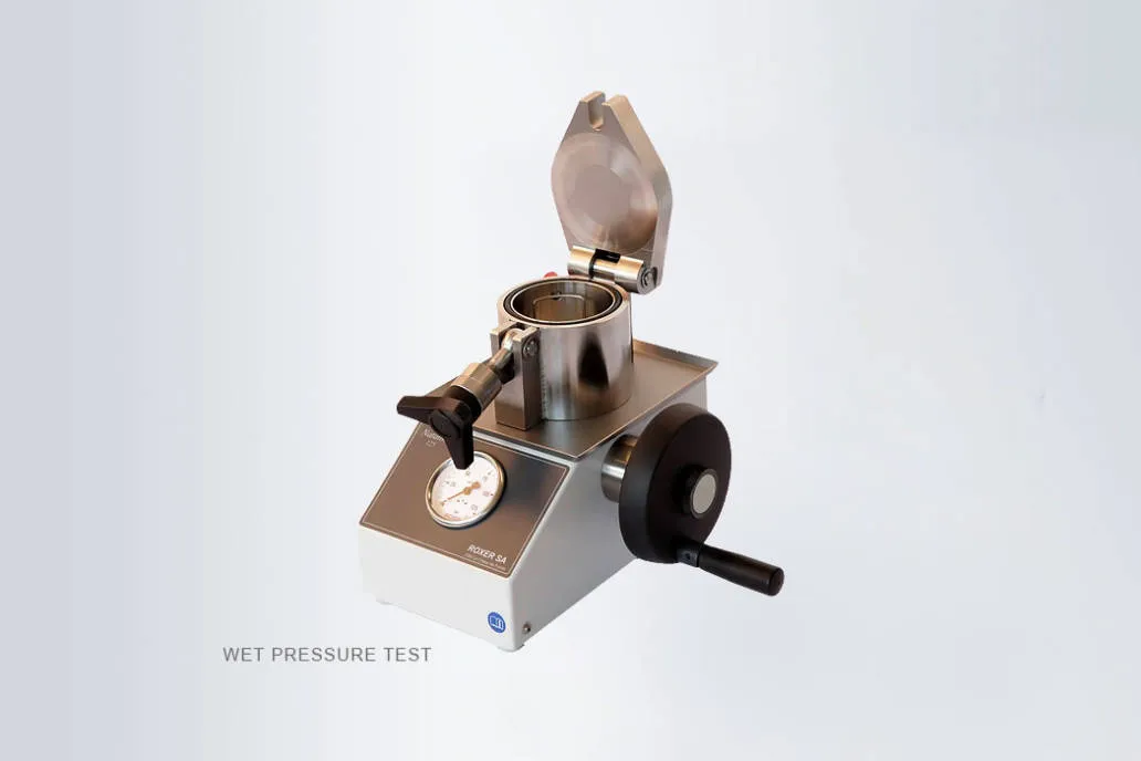 Wet pressure testing equipment for Rolex replica watches with Roxer Natator, verifying seals and water resistance up to 100m.